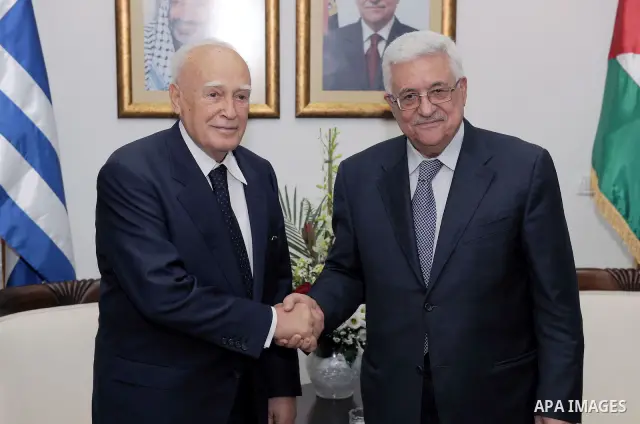 Palestinian President Mahmoud Abbas (Abu Mazen) shakes hands with Greek President, Karolos Papoulias during a meeting in the West Bank city of Ramallah on July 12, 2011. Photo by Thaer Ganaim