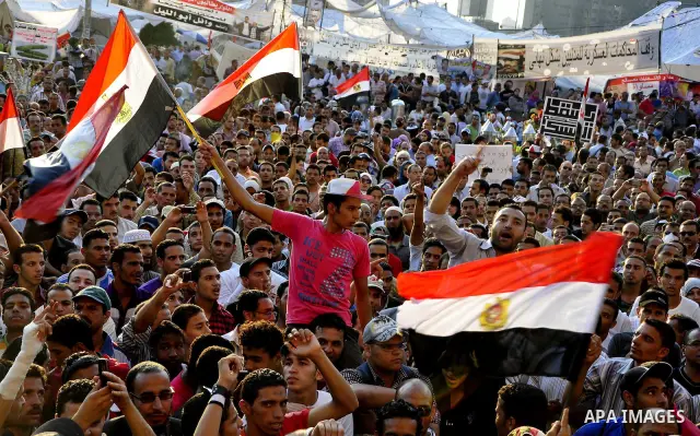 Egyptians are gathered at one of the Tharir square entrances where a sit-in is taking place, Cairo, Egypt, 12 July 2011. Egypt's military rulers on 12 July warned protesters against "harming public interests" after they...