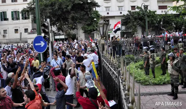 Egyptians are gathered at one of the Tharir square entrances where a sit-in is taking place, Cairo, Egypt, 12 July 2011. Egypt's military rulers on 12 July warned protesters against "harming public interests" after they...