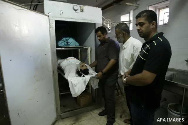 Palestinian Relatives identify the body of 21 year-old Ibrahim Sarhan, who was shot dead during an Israeli raid on the West Bank refugee camp Al-Fara, north of Nablus on July 13, 2011. Photo by Wagdi Eshtayah