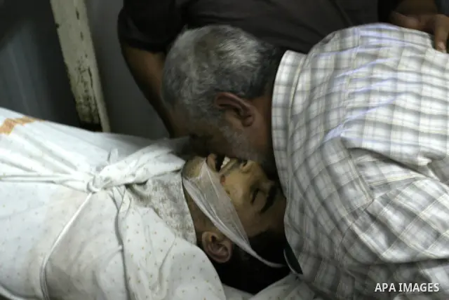 Palestinian Relatives identify the body of 21 year-old Ibrahim Sarhan, who was shot dead during an Israeli raid on the West Bank refugee camp Al-Fara, north of Nablus on July 13, 2011. Photo by Wagdi Eshtayah