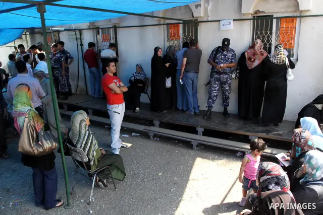Palestinians register their names with the Ministry of the Interior in the lists of travel in Gaza city on July 13, 2011. Where there are more than 20 thousand citizens need to travel abroad, The Egyptian side does not p...