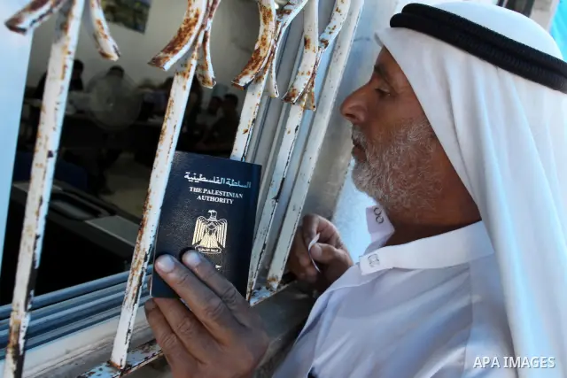 A Palestinian man waits to register his name with the Ministry of the Interior in the lists of travel in Gaza city on July 13, 2011. Where there are more than 20 thousand citizens need to travel abroad, The Egyptian side...
