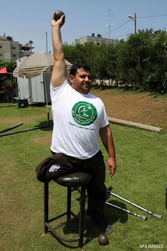 Palestinian members of the Olympic team for the disabled participate in training at Al-Gezira Club in Gaza city on July 13,2011. Palestinian Olympic team won Arab and international medals and have achieved excellent cent...