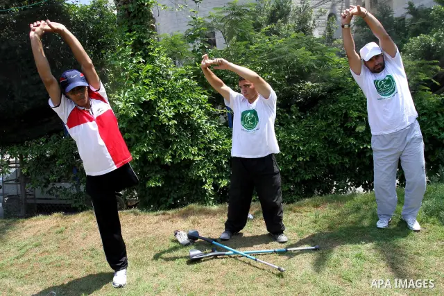 Palestinian members of the Olympic team for the disabled participate in training at Al-Gezira Club in Gaza city on July 13,2011. Palestinian Olympic team won Arab and international medals and have achieved excellent cent...