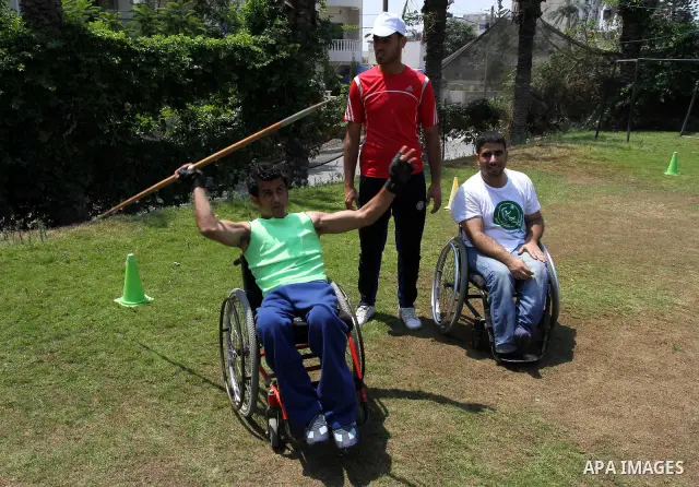 Palestinian members of the Olympic team for the disabled participate in training at Al-Gezira Club in Gaza city on July 13,2011. Palestinian Olympic team won Arab and international medals and have achieved excellent cent...