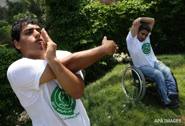 Palestinian members of the Olympic team for the disabled participate in training at Al-Gezira Club in Gaza city on July 13,2011. Palestinian Olympic team won Arab and international medals and have achieved excellent cent...