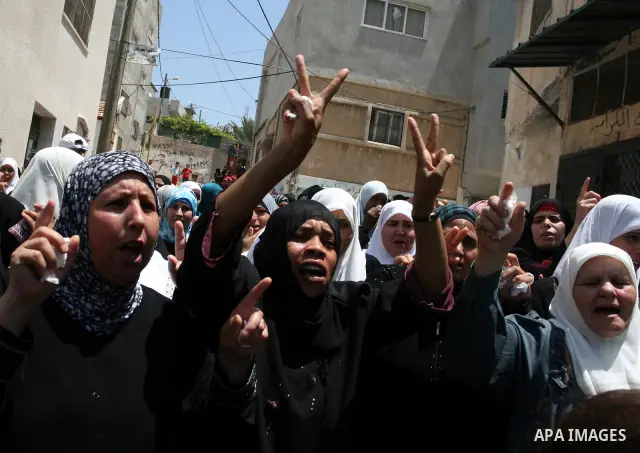 Palestinian women mourn the body of Ibrahim Sarhan, killed by Israeli military, during his funeral in the West Bank refugee camp of El Fara, north of Nablus, Wednesday, July 13, 2011. Sarhan was killed Wednesday in an Is...