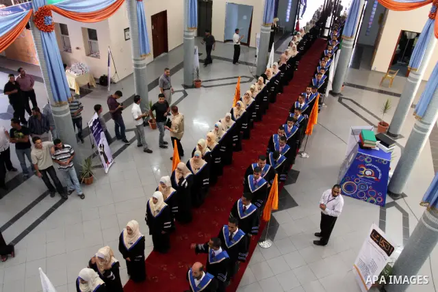 Palestinian students participate in their graduation ceremony at the Islamic University in Gaza city on July 13, 2011. Photo by Mohammed Asad