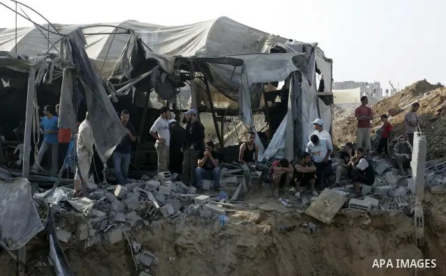 Palestinians inspect the site of a smuggling tunnel between the Gaza Strip and Egypt after it was targeted by an Israeli air strike overnight in Rafah, in the southern enclaved Palestinian territory, on July 14, 2011. Ph...