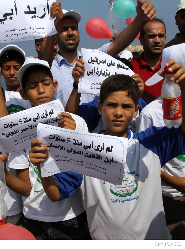 Children of Palestinian prisoners take part in a protest calling Israel to allow residents of Gaza to visit their relatives imprisoned in Israel, on July 14, 2011 in Gaza City. Israel stopped allowing Palestinians from t...