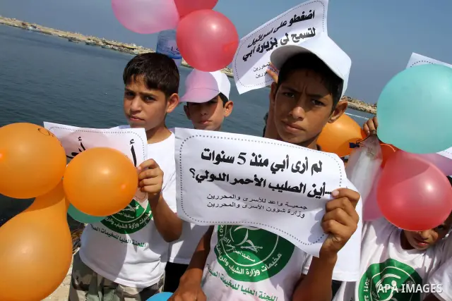 Children of Palestinian prisoners take part in a protest calling Israel to allow residents of Gaza to visit their relatives imprisoned in Israel, on July 14, 2011 in Gaza City. Israel stopped allowing Palestinians from t...