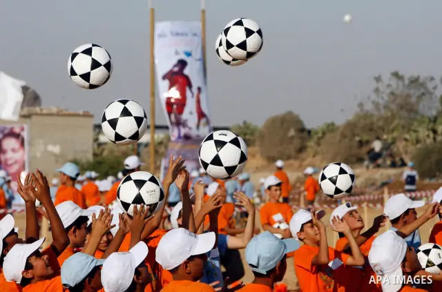 Palestinian children play with balls during summer camp activities supervised by the UN Relief and Works Agency (UNRWA) in Rafah in the southern Gaza Strip on July 14, 2011. Photo by Ali Jadallh