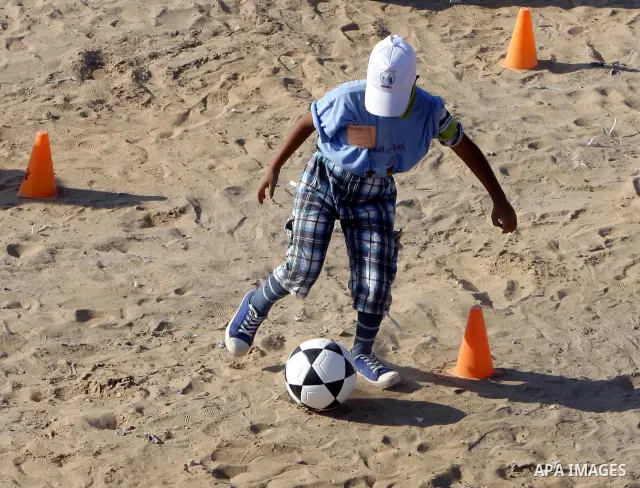 Palestinian children play with balls during summer camp activities supervised by the UN Relief and Works Agency (UNRWA) in Rafah in the southern Gaza Strip on July 14, 2011. Photo by Ali Jadallh