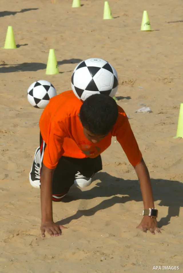 Palestinian children play with balls during summer camp activities supervised by the UN Relief and Works Agency (UNRWA) in Rafah in the southern Gaza Strip on July 14, 2011. Photo by Abed Rahim Khatib