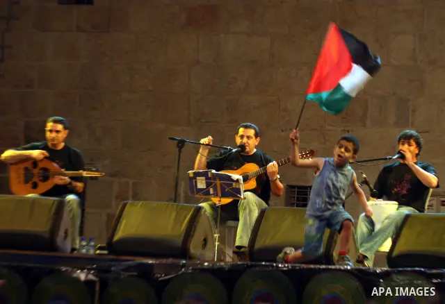 Members of the Palestinian band music, from the city of Akka, perform during the festival "Wayn ala Ramallah " in the West Bank city of Ramallah on July 14, 2011. Photo by Issam Rimawi