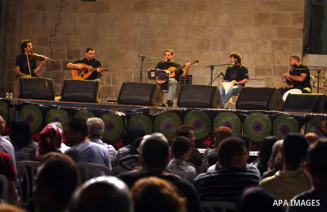 Members of the Palestinian band music, from the city of Akka, perform during the festival "Wayn ala Ramallah " in the West Bank city of Ramallah on July 14, 2011. Photo by Issam Rimawi