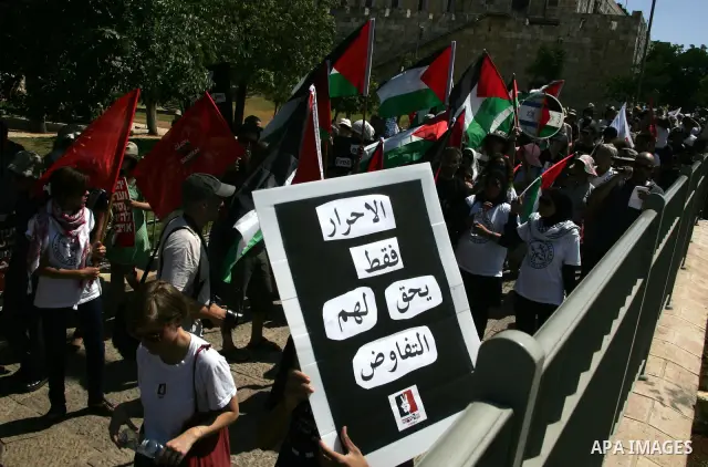 Israeli, Palestinian and foreign activists march calling for an independent Palestinian state on July 15, 2011. Some 1,000 Israelis and Palestinians gathered in east Jerusalem for a protest march to support the Palestini...