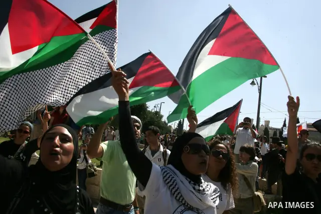 Israeli, Palestinian and foreign activists march calling for an independent Palestinian state on July 15, 2011. Some 1,000 Israelis and Palestinians gathered in east Jerusalem for a protest march to support the Palestini...