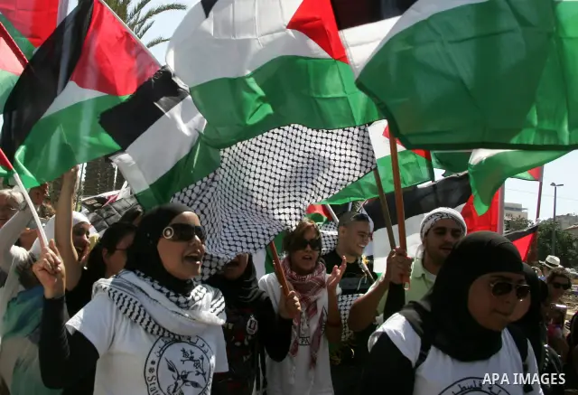 Israeli, Palestinian and foreign activists march calling for an independent Palestinian state on July 15, 2011. Some 1,000 Israelis and Palestinians gathered in east Jerusalem for a protest march to support the Palestini...