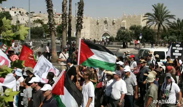 Israeli, Palestinian and foreign activists march calling for an independent Palestinian state on July 15, 2011. Some 1,000 Israelis and Palestinians gathered in east Jerusalem for a protest march to support the Palestini...