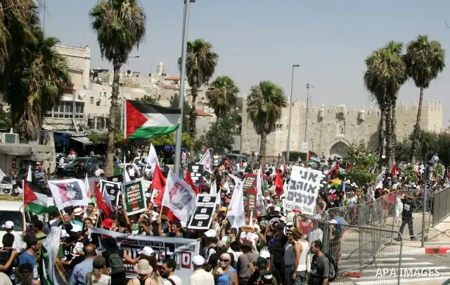 Israeli, Palestinian and foreign activists march calling for an independent Palestinian state on July 15, 2011. Some 1,000 Israelis and Palestinians gathered in east Jerusalem for a protest march to support the Palestini...