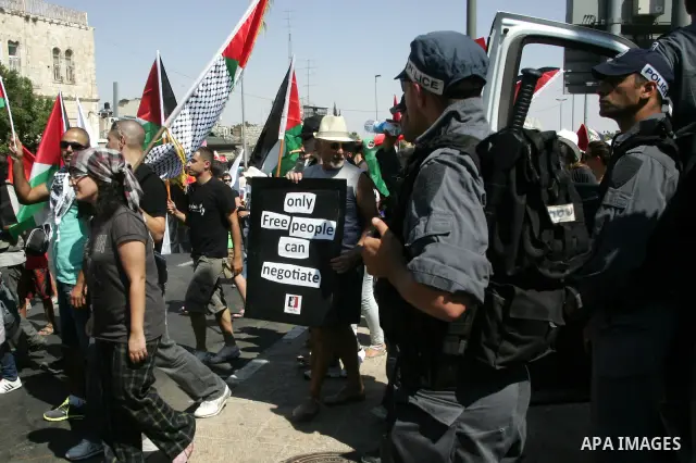 Israeli soldiers stand guards as Israeli, Palestinian and foreign activists march calling for an independent Palestinian state on July 15, 2011. Some 1,000 Israelis and Palestinians gathered in east Jerusalem for a prote...