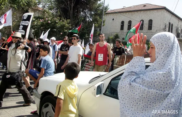 Israeli, Palestinian and foreign activists march calling for an independent Palestinian state on July 15, 2011. Some 1,000 Israelis and Palestinians gathered in east Jerusalem for a protest march to support the Palestini...