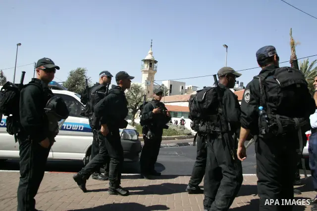 Israeli soldiers stand guards as Israeli, Palestinian and foreign activists march calling for an independent Palestinian state on July 15, 2011. Some 1,000 Israelis and Palestinians gathered in east Jerusalem for a prote...