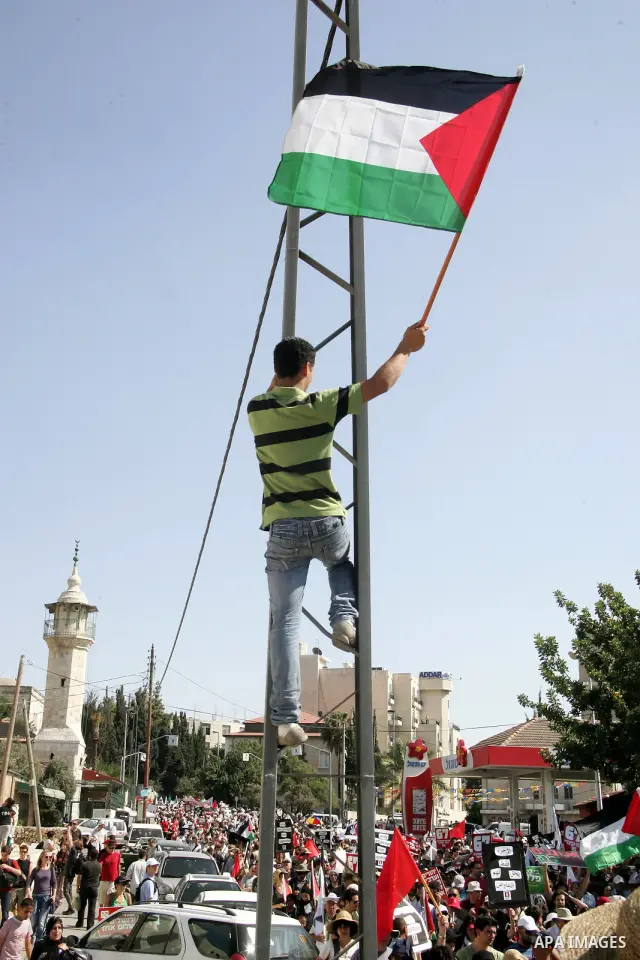 Israeli, Palestinian and foreign activists march calling for an independent Palestinian state on July 15, 2011. Some 1,000 Israelis and Palestinians gathered in east Jerusalem for a protest march to support the Palestini...
