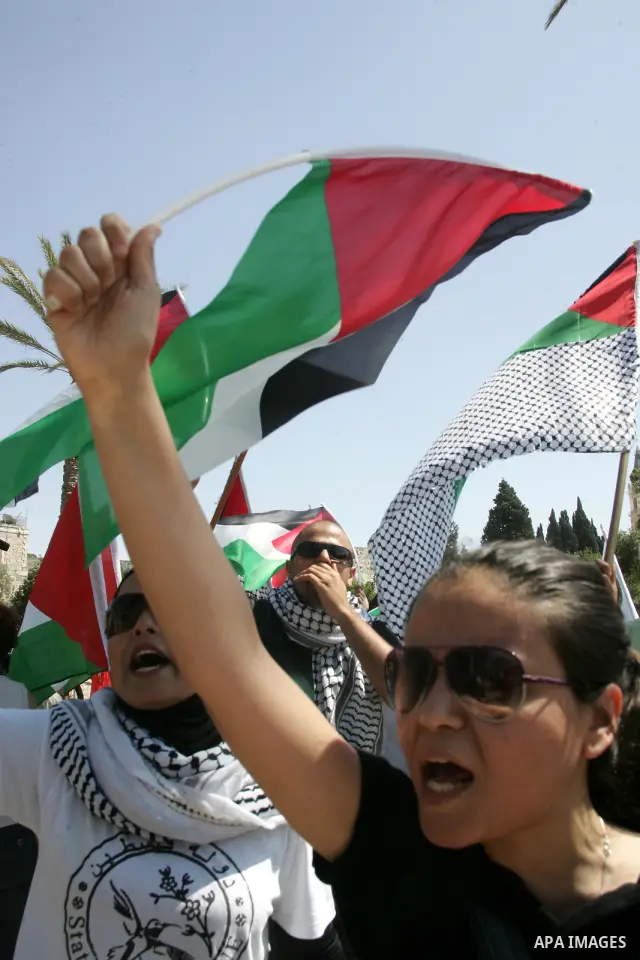 Israeli, Palestinian and foreign activists march calling for an independent Palestinian state on July 15, 2011. Some 1,000 Israelis and Palestinians gathered in east Jerusalem for a protest march to support the Palestini...