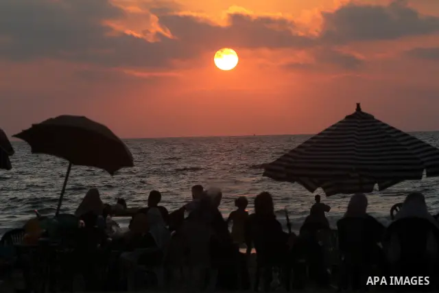 Palestinians enjoy their times in the sea on Gaza's beach on on July 15, 2011. Reports state that during the summer the beach is a major venue for entertainment and leisure in the Gaza. Photo by Mohammed Asad
