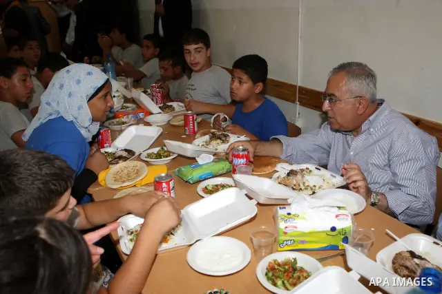 Palestinian Prime Minister, Salam Fayyad visits the summer camp "Palestine in the eyes of martyrs' sons" in al-Fara'a refugee camp in the West Bank on July 16, 2011. Photo by Mustafa Abu Dayeh