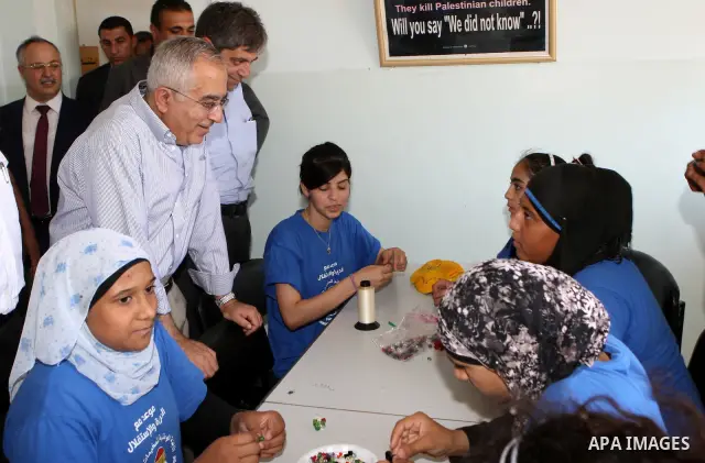 Palestinian Prime Minister, Salam Fayyad visits the summer camp "Palestine in the eyes of martyrs' sons" in al-Fara'a refugee camp in the West Bank on July 16, 2011. Photo by Mustafa Abu Dayeh