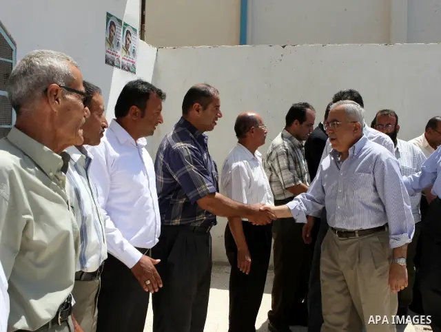 Palestinian Prime Minister, Salam Fayyad visits the family of the Martyr Ibrahim Sarhan in al-Fara'a refugee camp in the West Bank on July 16, 2011. Photo by Mustafa Abu Dayeh