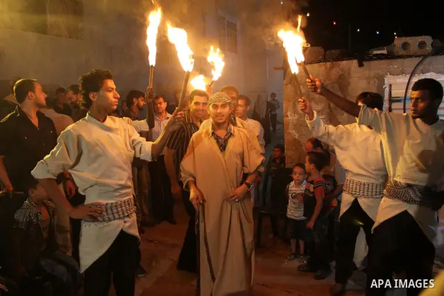 Palestinian youths dance the traditional dabka around the groom during his ceremony in Gaza city on July 16, 2011. Photo by Mohammed Asad