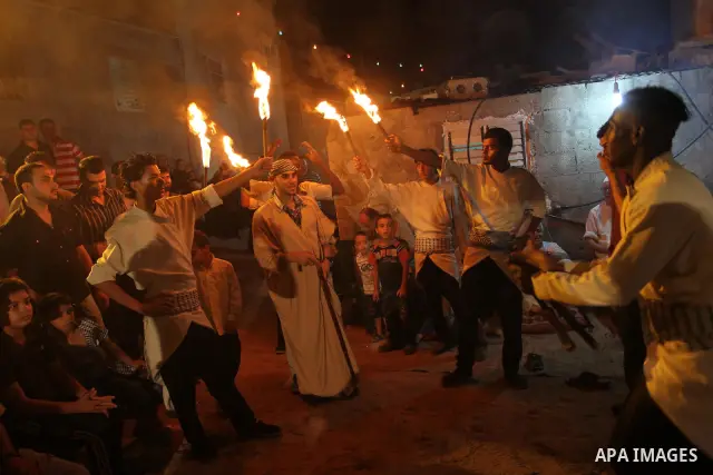 Palestinian youths dance the traditional dabka around the groom during his ceremony in Gaza city on July 16, 2011. Photo by Mohammed Asad