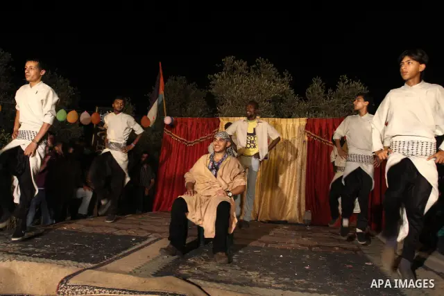 Palestinian youths dance the traditional dabka around the groom during his ceremony in Gaza city on July 16, 2011. Photo by Mohammed Asad