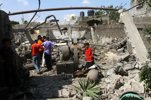 Palestinians inspect damages in Beit Hanun in the northern Gaza Strip on July 17, 2011 as seven people were wounded by what Palestinian medical sources said was an Israeli air strike, but Israel denied it had carried out...