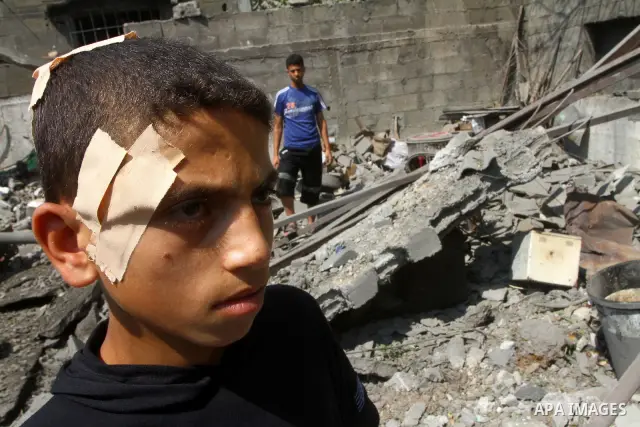 A Palestinian boy inspects damages in Beit Hanun in the northern Gaza Strip on July 17, 2011 as seven people were wounded by what Palestinian medical sources said was an Israeli air strike, but Israel denied it had carri...