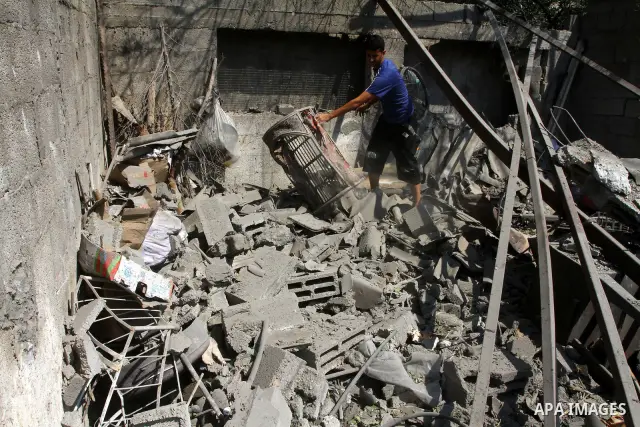 A Palestinian man inspects damages in Beit Hanun in the northern Gaza Strip on July 17, 2011 as seven people were wounded by what Palestinian medical sources said was an Israeli air strike, but Israel denied it had carri...