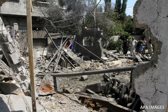 A Palestinian man inspects damages in Beit Hanun in the northern Gaza Strip on July 17, 2011 as seven people were wounded by what Palestinian medical sources said was an Israeli air strike, but Israel denied it had carri...