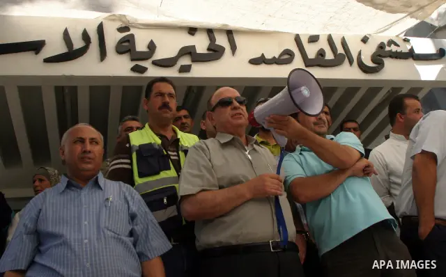 Palestinian staff of Maqasid hospital take part in a protest against the health Ministry calling to pay their dues in Jerusalem on July 18, 2011. Photo by Mahfouz Abu Turk