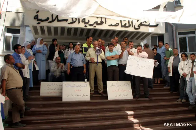 Palestinian staff of Maqasid hospital take part in a protest against the health Ministry calling to pay their dues in Jerusalem on July 18, 2011. Photo by Mahfouz Abu Turk