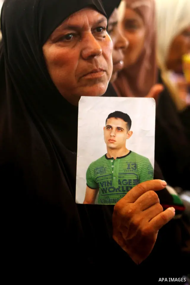 Mothers of Palestinian prisoners held in Israeli jails attend a weekly protest calling for the release of Palestinian prisoners at the International Red Cross building in Gaza City 18 July 2011. It is reported that about...