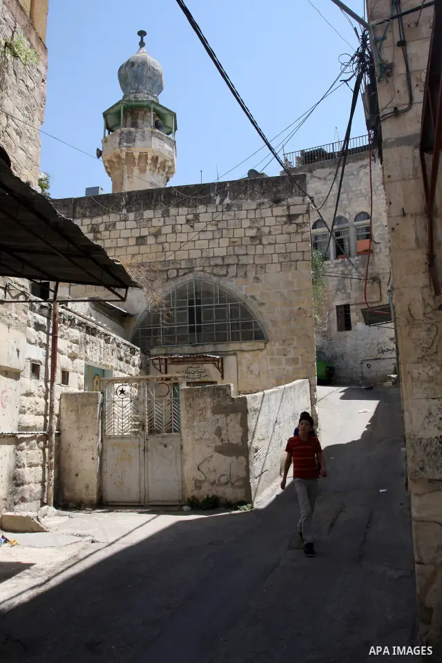 A Palestinian boy walks in the Old City of Nablus in the West Bank on July 18, 2011. Photo by Wagdi Eshtayah