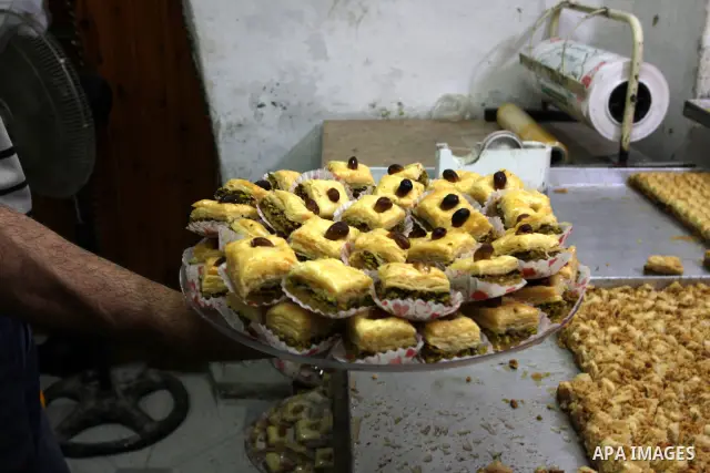 A Palestinian vendor traditional sweets in the Old City of Nablus in the West Bank on July 18, 2011 . Photo by Wagdi Eshtayah