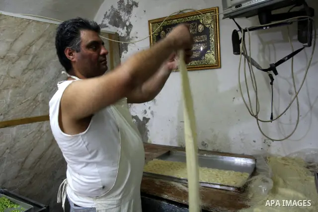A Palestinian vendor traditional sweets in the Old City of Nablus in the West Bank on July 18, 2011 . Photo by Wagdi Eshtayah