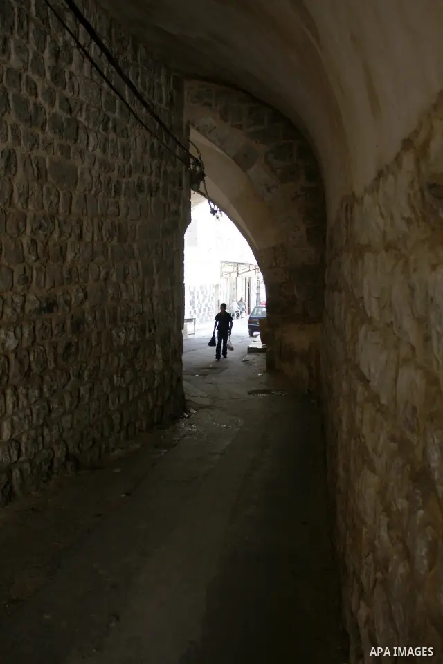 A Palestinian boy walks in the Old City of Nablus in the West Bank on July 18, 2011. Photo by Wagdi Eshtayah
