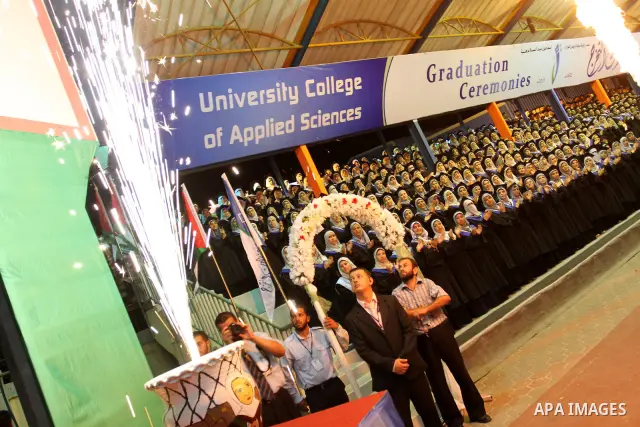 Palestinian students participate in their graduation ceremony at the University College of Applied Sciences in Gaza city on July18, 2011. Photo by Mohammed Asad